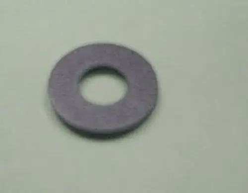 Dichtung von Remeha, runde Form mit einem zentralen Loch. Material scheint weich und flexibel zu sein.